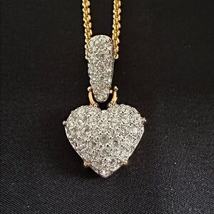 Swarovski NWOT heart goldtone necklace. Covered in crystals with enhancer clasp